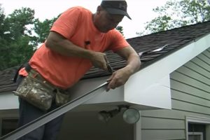 Roofing worker installing drip edge on the roof